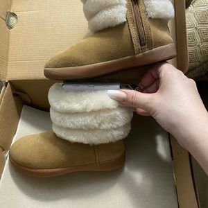 ize 10c UGG boots. So cute and only worn about 5 times! Outgrown too soon.